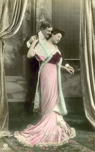 Man making advances on fashionable lady by French Photographer
